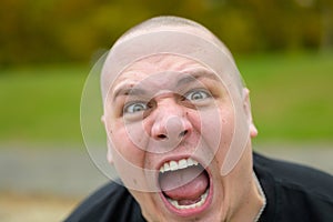 Young man yelling at the camera in frustration