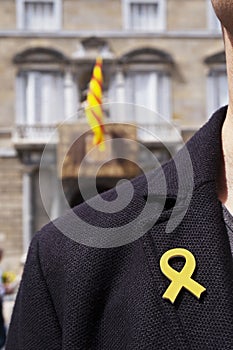 Man with a yellow ribbon in Barcelona, Spain photo