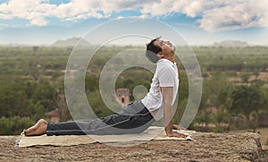 Young Man In Yoga Pose