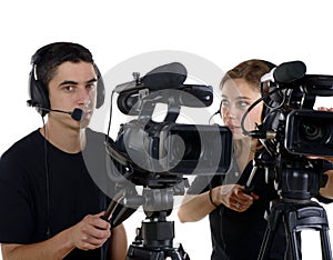 Young man and young woman with video cameras