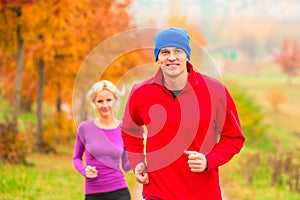 Young married couple athletes on the jog