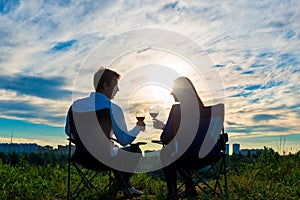 Young married couple with a glass of wine