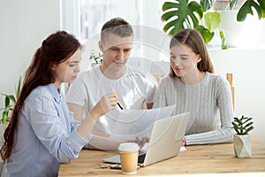 Young married couple at meeting with architect