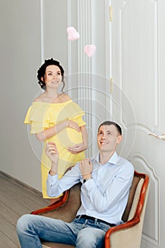 Young married couple waiting for a miracle, pregnant wife with her husband