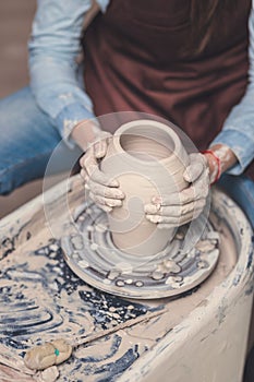 Young master at the potter`s wheel