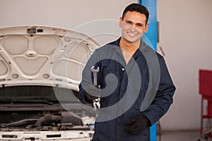 Young mechanic loving his job