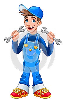 Young mechanic with monkey wrenches in his hands