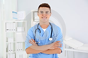Young medical assistant with stethoscope photo