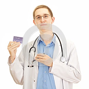 A young medical doctor with a credit card photo