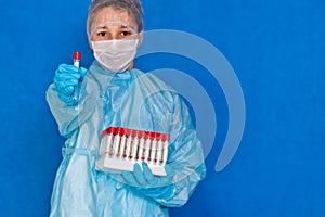 Young medical professional wearing mask and gloves with empty test tubes in hands ready to use