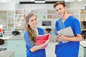 Young medical students smiling at camera