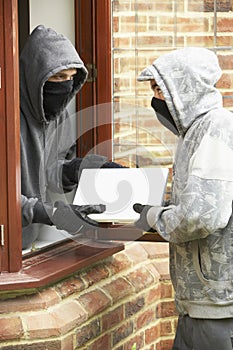 Young Men Breaking Into House