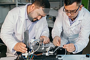 Young men are engaged in setting up a water purifier