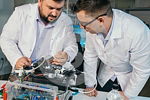 Young men are engaged in setting up a water purifier