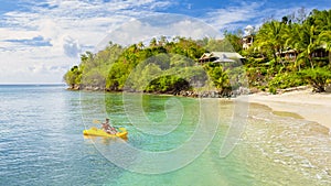 young men in kayak at a tropical island in the Caribbean sea, St Lucia or Saint Lucia