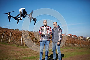 Young men manages drone`s flight