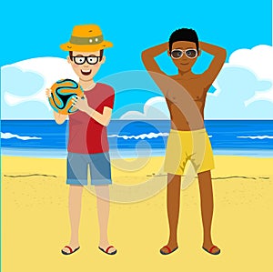 Young men posing with soccer ball on summer beach