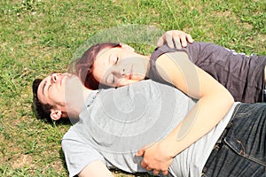 Couple of lovers lying on meadow