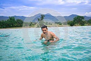 Young men relaxing in a waterpool