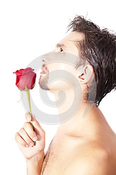 Young men smell the red rose