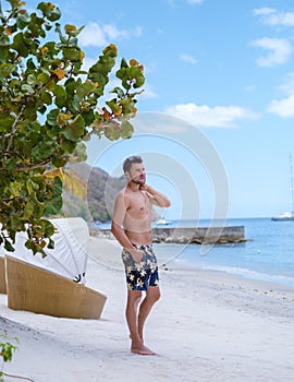 young men in swimshort on vacation Saint Lucia, luxury holiday Saint Lucia Caribbean Sugar beach