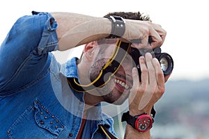 Young men taking photo of his girlfriend.