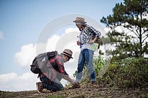 Young men are tying shoes to lover