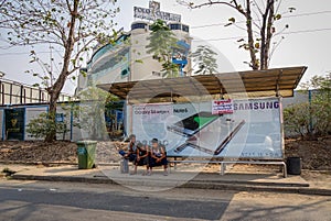 Young men waiting at bus station