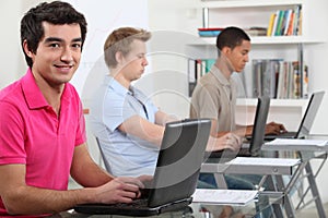 Young men working on computers
