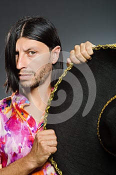 The young mexican man wearing sombrero