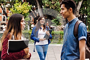 Young mexican woman in group of Latin students in university in Latin America