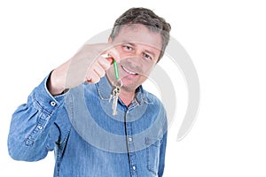 Young middle aged man hand over keys with empty white background