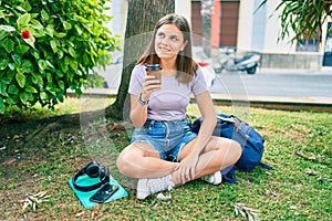 Young middle east student girl smiling happy drinking coffee at the university campus