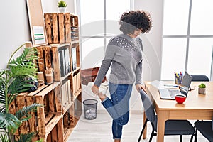 Young middle east woman business worker stretching leg at office