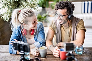 Young millenial couple sharing creative content online on webcam - Digital marketing concept with next generation influencer photo