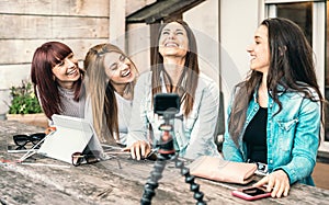 Young millennial women having fun on streaming platform through digital action web cam - Influencer marketing concept photo