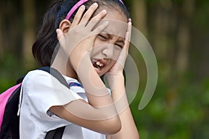 Young Minority Girl Student Under Stress With Books