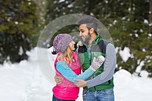 Young Mix Race Couple Embrace Snow Forest Outdoor Winter Walk