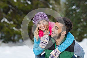 Young Mix Race Couple Embrace Snow Forest Outdoor Winter Walk