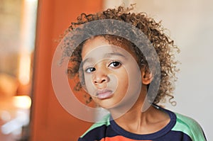 Young mixed race boy with curly hair