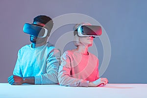 Young mixed race couple having fun with VR glasses