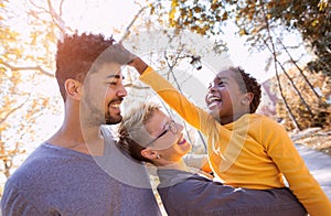 Young mixed race couple spending time with their daughter