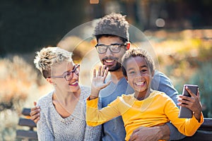 Young mixed race couple spending time with their daughter