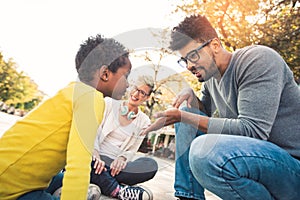 Young mixed race couple spending time with their daughter