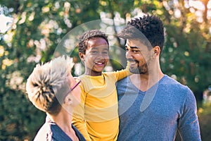 Young mixed race couple spending time with their daughter