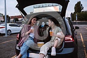 Young mixed race girls at auto cinema parking