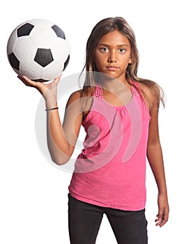 Young mixed race school girl holding soccer ball