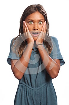 Young mixed race school girl surprised expression