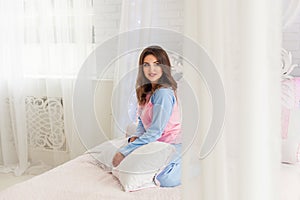 Young model in beautiful bedroom