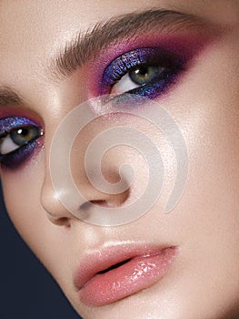 Young model with lilac smoky eyes